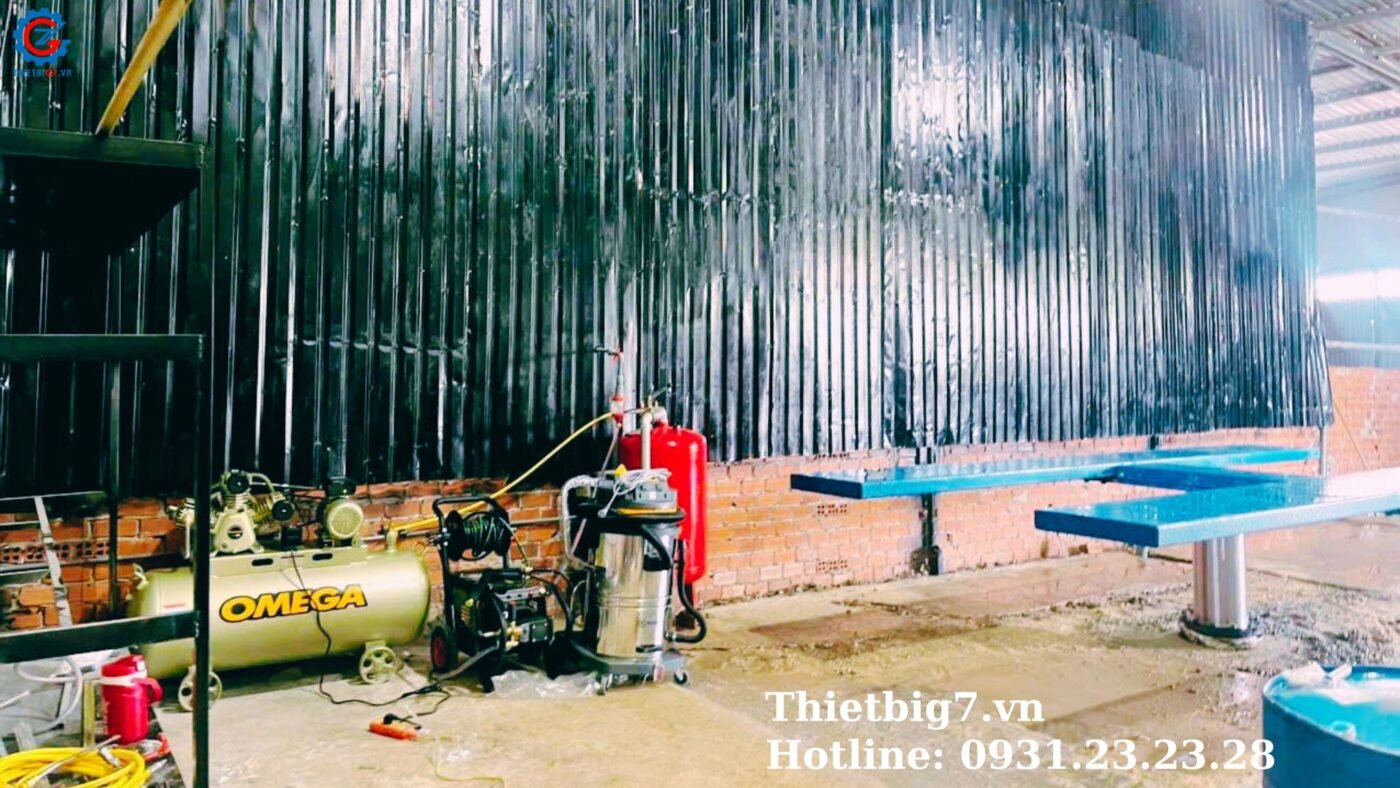 Industrial workspace with equipment and tools.